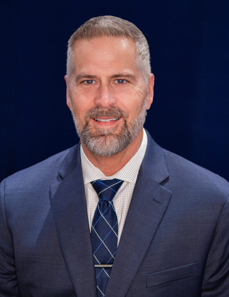 Headshot of former Florida superintendent and public education advocate John Stratton 