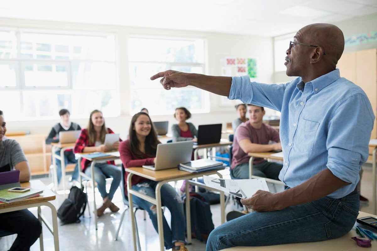 A high school teacher leading an advanced course