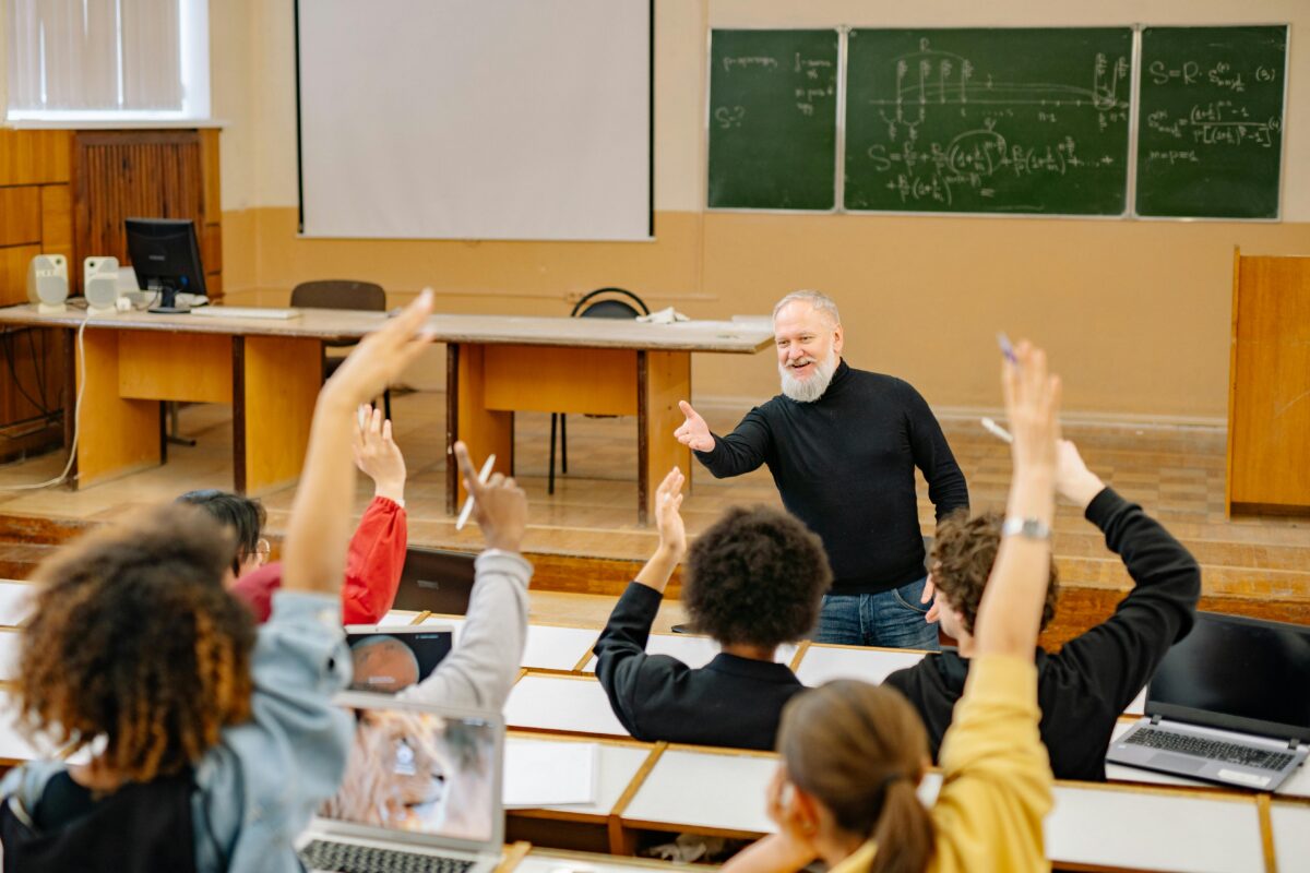 A professor leading a college class. Dual enrollment classes, in which high school students take college courses, are increasing in popularity.